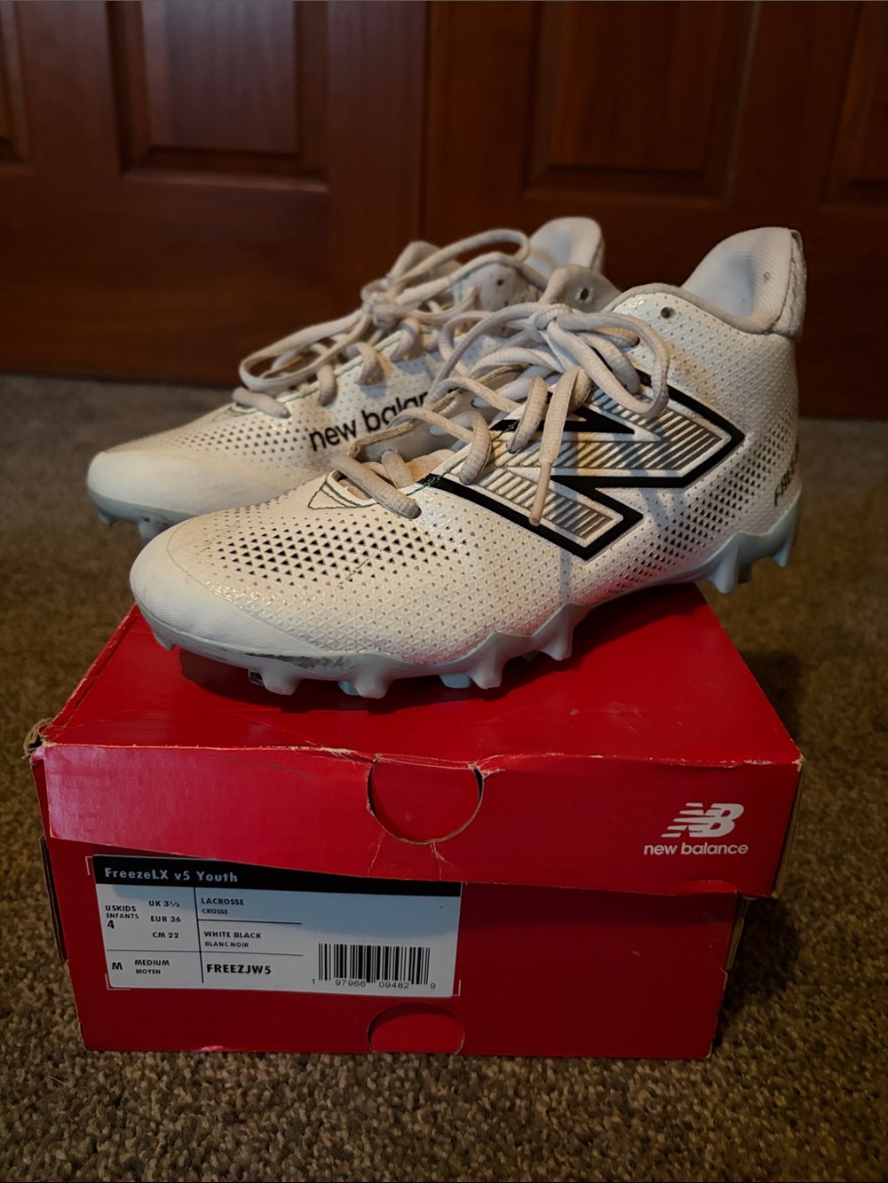 New Balance Kids White Lacrosse Cleats with Black Logo